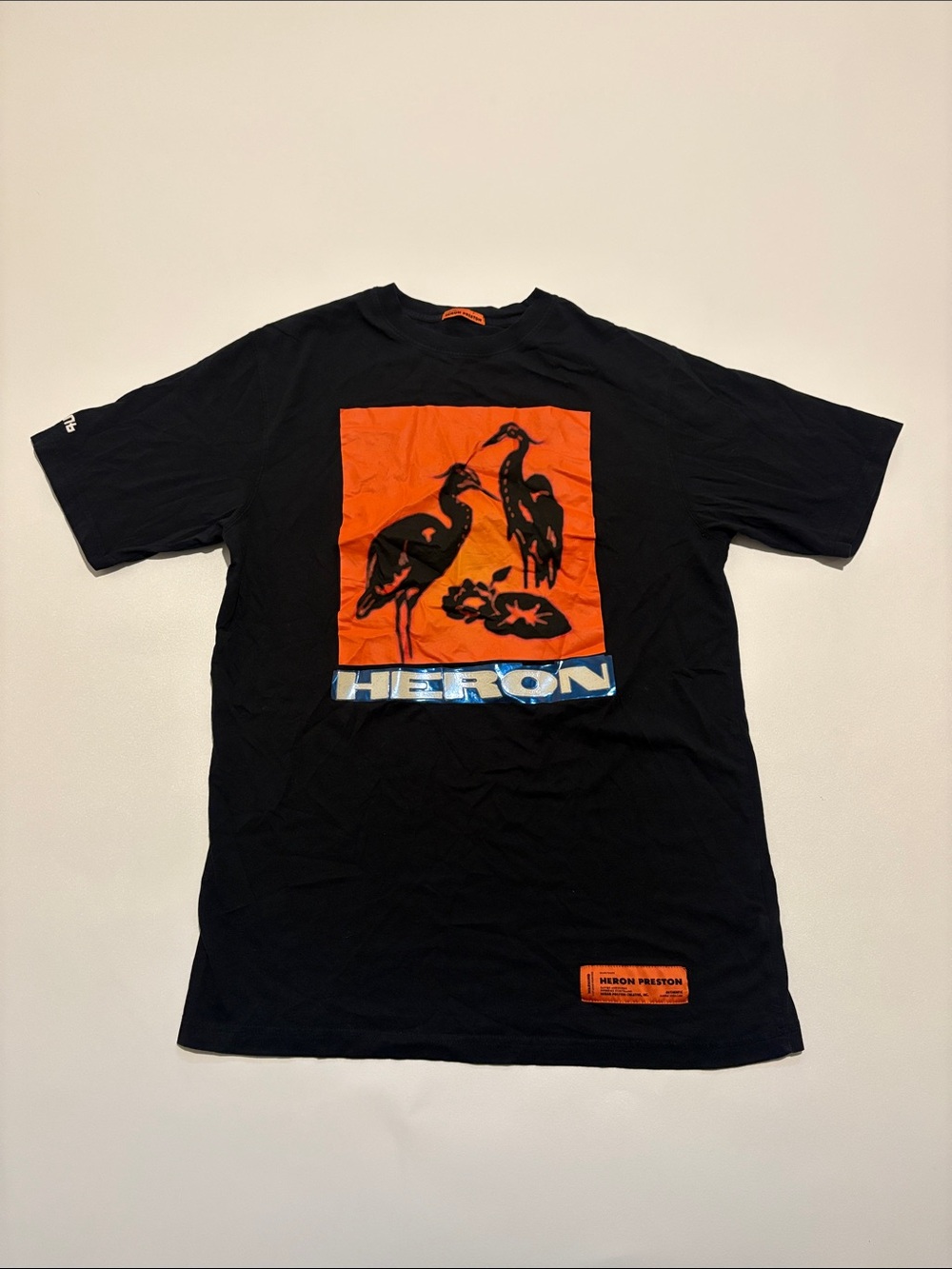 Heron Preston Black Tee with Orange Heron Graphic